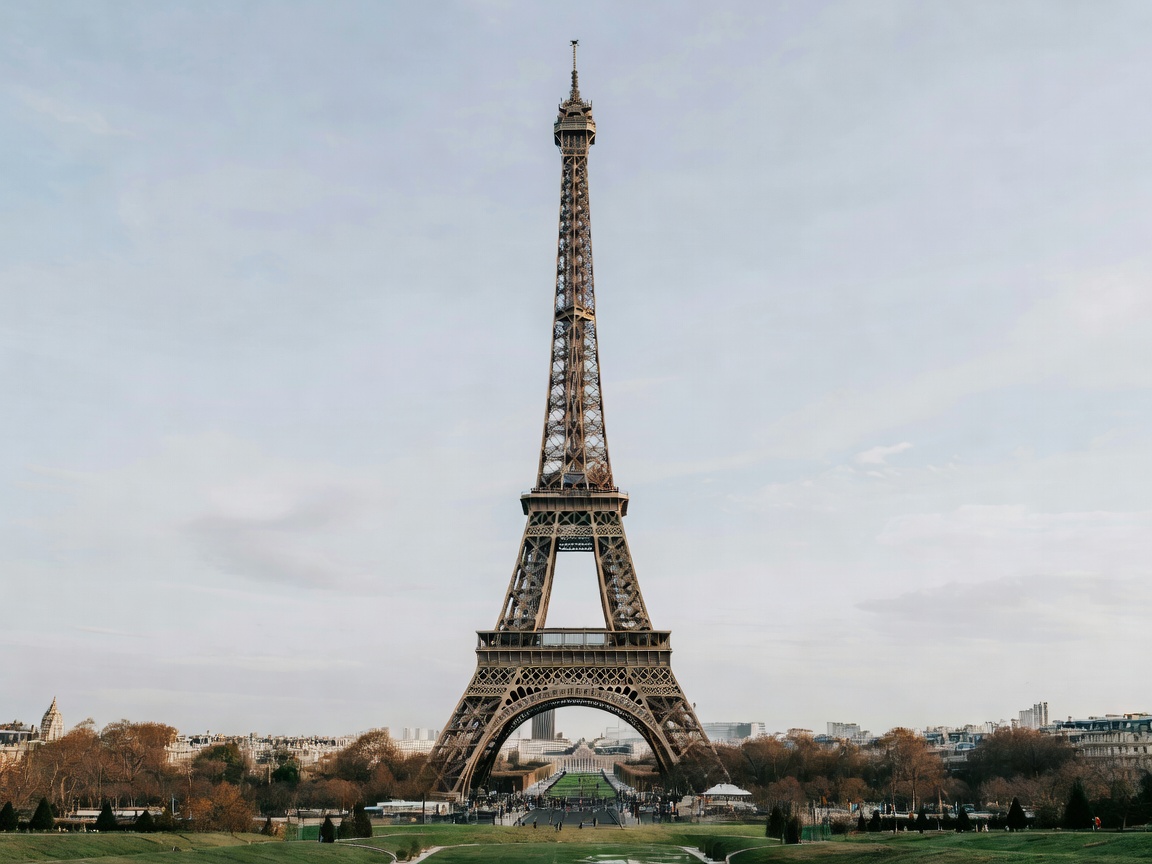 Eiffel Tower standing tall in Paris during soft daylight